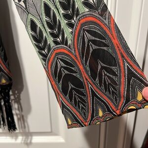 MONTEAU IBIZA style sheer blouse with fringe trim.